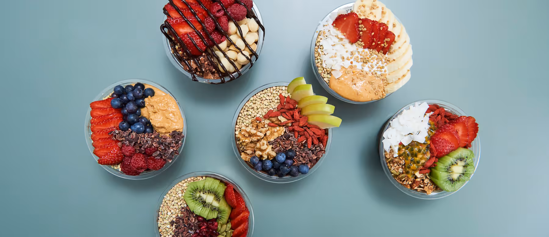 Fresh acai bowls with tropical fruit toppings